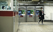 Passerby is seen entering a nearly empty subway, in New York, United States, on March 24,...
