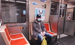 An elderly SEPTA rider wears a protective mask and gloves for his commute to work on the S...