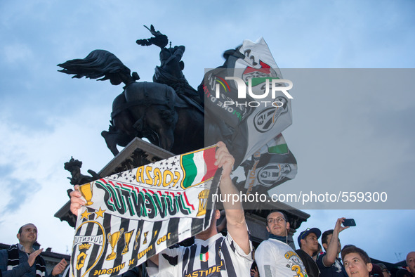 Juventus supporter  rejoice on 2nd May in S. Carlo Square of Turin, Italy,  for   winning   the italian league with 4 match in advance. 