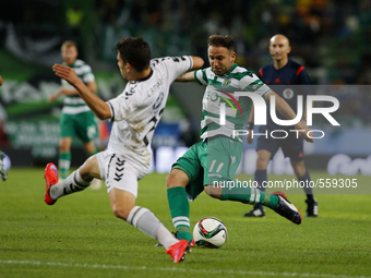 Sporting's midfielder Diego Capel  (R) vies for the ball with Nacional's defender Nuno Campos (R)  during the Portuguese League  football ma...