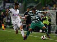 Sporting's midfielder Diego Capel (R) vies for the ball with Nacional's midfielder Joao Aurelio (L)  during the Portuguese League  football...