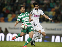 Sporting's forward Fredy Montero (L) scores his team's first goal  during the Portuguese League  football match between Sporting CP and CD N...