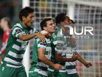 Sporting's forward Fredy Montero  (R) celebrates his goal with his teammates  during the Portuguese League  football match between Sporting...