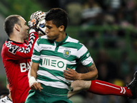 Nacional's goalkeeper Gottardi (L) vies with Sporting's Colombian forward Fredy Montero during the Portuguese League football match between...