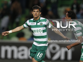 Sporting's forward Fredy Montero  (L)  celebrates after scoring his team's second goal  during the Portuguese League  football match between...