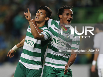Sporting's forward Fredy Montero  (L)  celebrates his goal with Sporting's forward Andre Carrillo (R)  during the Portuguese League  footbal...