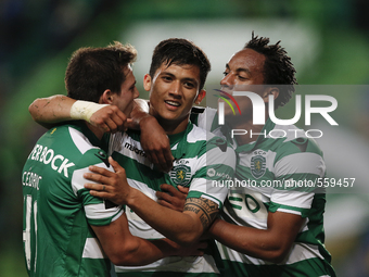 Sporting's forward Fredy Montero  (L)  celebrates his goal with Sporting's forward Andre Carrillo (R) and Sporting's defender Cedric  (L)  d...