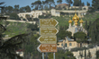 DIrection signs with the Church of Mary Magdalene in the bacground.On Wednesday, March 11...