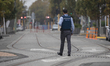 A police officer patrols an empty street in Christchurch, New Zealand, on April 01, 2020. ...