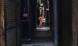 Cairo, Egypt, April 3, 2020 A man walks in front of closed shops in Cairo, as the Egyptian...