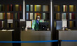 A member of the hotel staff makes a call from the reception on April 9, 2020 in Barcelona,...