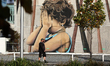 A man walks past a graffiti in Christchurch, New Zealand, on April 16, 2020. New Zealand i...