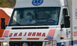 Medical workers wearing hazmat suits and protective helmets and masks, seen in an ambulanc...