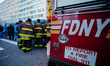 New Yorkers applaud first responders and medical workers in front of Mount Sinai hospital...