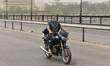 A man wearing face mask rides a motorcycle during a sandstorm in Cairo, Egypt, 24 April 20...