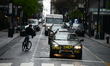 Left-wing protestors engage in a "socially distanced protest" in cars and on bicycles, cal...