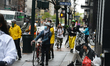 Left-wing protestors engage in a "socially distanced protest" in cars and on bicycles, cal...