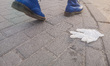Used medical disposable glove laying on the pavement is seen in Gdansk, Poland on 26 April...