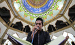 People are seen reading the Koran at night during the holy month of Ramadan at the Mosque...