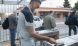 An employee of Italian automobile manufacturer FCA enters the Mirafiori plant.The work re...