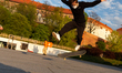 A man in protective face mask is seen practicing his skating skills in front of Wawel cast...