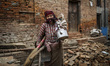 People of Bhaktapur are collecting their households from the collapsed building after eart...