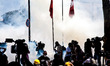 ISTANBUL, TURKEY--A line of cameramen is sillhoetted against tear gas fired by police in T...