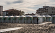 A girl in front of the entrance to the beach at the Lido di Venezia. People after the 4th...