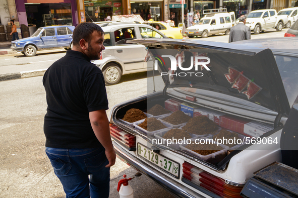 A tobacco seller  (the tobacco is put in the trunk of his car) in Hebron, Palestine, May 6th 2015.  