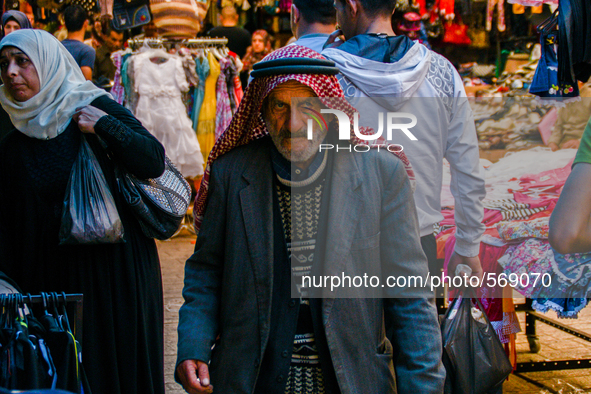 A man walks in the old market in Hebron, Palestine, May 6th 2015.  