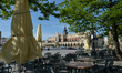 A view of Sukiennice (The Cloth Hall) and empty tables outside a closed restaurant in Krak...