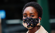 A view of a woman wearing a maskin New York City USA during the coronavirus pandemic on Ma...