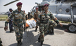 KATHAMNDU, NEPAL-- May 6, 2015--Military officials carry the bodies of 7 earthquake victim...