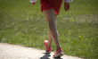A man wearing shorts and Nike runing shoes is seen in the Royal Baths park in Warsaw, Pola...