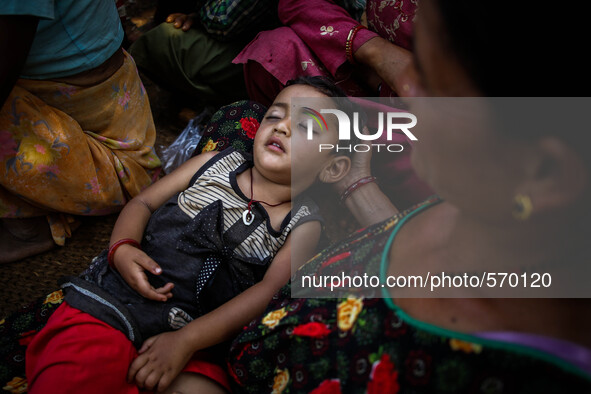 Nirjala, 3 has been suffering from high fever and fainted out during surviving earthquake. Bandevi village, Kabrepalan Chowk, Nepal. May 6,...