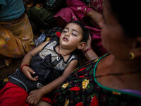 Nirjala, 3 has been suffering from high fever and fainted out during surviving earthquake. Bandevi village, Kabrepalan Chowk, Nepal. May 6,...