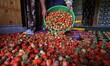  A Kashmiri farmer spreading the harvested strawberries inside his residence on the outski...