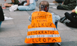 A protester with jacket which is written ''no stupility and no democraty where are you Eur...