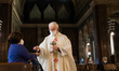 Parish priest celebrates mass in the First day when religious services are allowed again...
