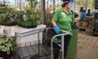 Employee wearing a plastic face shield to protect them from the novel coronavirus (COVID-1...