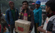 A man carrying an apple box come from China who was leave as a waste inside a destroyed Ch...