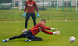 Michal Buchalik (in action) and Mateusz Lis, Wisla Krakow's goalkeepers, seen during a tra...