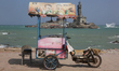 Ice cream cart in the town of Kanyakumari, Tamil Nadu, India. In the distance is the Thiru...