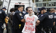 Police arrest a demonstrator, during a protest in response to the death of Minneapolis man...