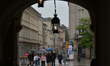 People with umbrellas seen in Krakow's Main Market Square during rainy weather.Rain has r...
