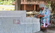 Worker cuts stone during re-construction of the Raja Gopuram tower of the Arul Eswari Muth...