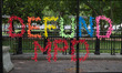 A message to de-fund Washington D.C.'s police force is seen along temporary fencing instal...