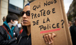 A woman holds a cardboard reading 'Who protect us from the police'. Several organizations...