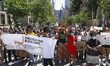Hundreds of demonstrators walk to Gracie Mansion, the official residence of the Mayor of N...
