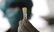 A health worker collected a sample of a man for the COVID-19 coronavirus test amid the cor...